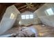 Unfinished upper level room with hardwood floors and multiple windows at 43 Gammon Se Ave, Atlanta, GA 30315