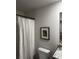 Simple bathroom with a white waffle shower curtain and granite vanity at 109 Meadowview # 22, Temple, GA 30179