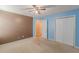 Bedroom with ceiling fan and double-door closet at 5439 Village Rdg, Fairburn, GA 30213