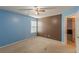 Bedroom with ceiling fan and two-tone walls at 5439 Village Rdg, Fairburn, GA 30213