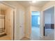 Hallway with access to bedrooms and bathroom at 5439 Village Rdg, Fairburn, GA 30213