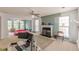 Spacious living room with a fireplace and large windows at 5439 Village Rdg, Fairburn, GA 30213