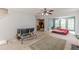 Open living area with kitchen view and a ceiling fan at 5439 Village Rdg, Fairburn, GA 30213