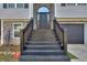 Dark-stained wooden stairs leading to the front door of the house at 75 Lumby Ln, Covington, GA 30016