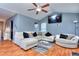 Living room with vaulted ceiling, hardwood floors, and a fireplace at 75 Lumby Ln, Covington, GA 30016