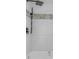 Clean bathroom with white tile and a modern shower/tub combo at 2080 Bluffton Way, Decatur, GA 30035