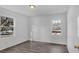 Bright bedroom with large window and wood-look floors, bathed in natural light at 2080 Bluffton Way, Decatur, GA 30035