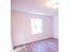 Bright bedroom with wood-look floors and large window at 2080 Bluffton Way, Decatur, GA 30035