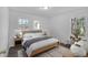 Bright bedroom with wood-look floors, large windows, and neutral decor at 2080 Bluffton Way, Decatur, GA 30035