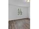 Spacious bedroom with new wood-look flooring and large window at 2080 Bluffton Way, Decatur, GA 30035