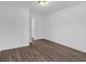 Bright bedroom with wood-look floors and access to hallway at 2080 Bluffton Way, Decatur, GA 30035