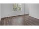 Bright bedroom with hardwood floors and large window at 2080 Bluffton Way, Decatur, GA 30035