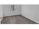 Simple bedroom with wood-look floors and a large window, offering natural light at 2080 Bluffton Way, Decatur, GA 30035