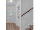 Clean entryway with white door and wooden staircase at 2080 Bluffton Way, Decatur, GA 30035
