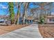 Front view of a charming house with a long driveway at 2080 Bluffton Way, Decatur, GA 30035
