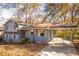 Ranch style home with carport and mature trees in the yard at 2080 Bluffton Way, Decatur, GA 30035