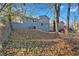 Back of house with light blue siding and wooded backyard at 2080 Bluffton Way, Decatur, GA 30035