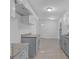 Modern kitchen with gray cabinets, granite counters and tile floors at 2080 Bluffton Way, Decatur, GA 30035