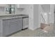 Modern kitchen with gray cabinets, granite counters and stainless steel dishwasher at 2080 Bluffton Way, Decatur, GA 30035