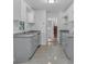 Modern kitchen with gray cabinets and granite countertops at 2080 Bluffton Way, Decatur, GA 30035