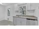 Modern kitchen with gray cabinets, granite counters and stainless steel appliances at 2080 Bluffton Way, Decatur, GA 30035