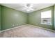 Simple bedroom with green walls and beige carpeting at 45 Eagle Glen Ne Dr, Cartersville, GA 30121