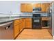 Modern kitchen with stainless steel appliances and wood cabinets at 45 Eagle Glen Ne Dr, Cartersville, GA 30121