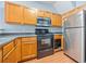 Kitchen features stainless steel appliances and wood cabinets at 45 Eagle Glen Ne Dr, Cartersville, GA 30121