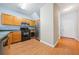Open kitchen and hallway with wood floors and neutral colors at 45 Eagle Glen Ne Dr, Cartersville, GA 30121