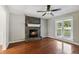 Living room with hardwood floors, fireplace, and window at 2852 Emerson Lake Dr, Snellville, GA 30078