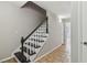 Dark wood staircase with white railings at 2852 Emerson Lake Dr, Snellville, GA 30078