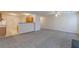Open concept living room and kitchen with gray carpeting at 3757 Harvest Dr, Decatur, GA 30034