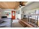 Open living space with a cozy daybed, kitchen views, and wood ceilings at 24 Allatoona Landing Lot 19 Se Rd, Cartersville, GA 30121