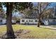 House front with yard, trees, and neighboring homes at 2487 Spring Garden Sw Dr, Atlanta, GA 30315