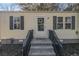 House front featuring a welcoming porch and landscaping at 2487 Spring Garden Sw Dr, Atlanta, GA 30315