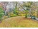 Spacious backyard with a mix of trees and grass at 1273 Anchor Sw Ter, Atlanta, GA 30311