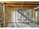 Unfinished basement with exposed framing, plumbing, and electrical work at 1273 Anchor Sw Ter, Atlanta, GA 30311