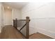 Modern staircase with dark wood railings and white wall paneling at 520 Fisher Dr # 44, Alpharetta, GA 30009