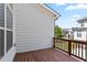 Private deck with wood flooring and views of neighboring homes at 3879 Glenview Club Ln, Duluth, GA 30097