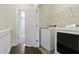 Convenient laundry room with washer, dryer and shelving at 3879 Glenview Club Ln, Duluth, GA 30097