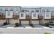 Rear view of townhouses with attached garages and private decks at 3879 Glenview Club Ln, Duluth, GA 30097