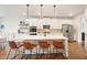 Stylish kitchen with white island, pendant lighting, and seating for four at 470 Carmichael Cir, Canton, GA 30115