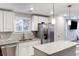 Modern kitchen with white cabinets and granite countertops at 70 Caroline Ave, Stockbridge, GA 30281