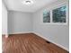 Spacious bedroom with hardwood floors and large window at 2142 Cloverdale Se Dr, Atlanta, GA 30316