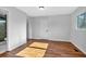 Light-filled bedroom, hardwood floors, and a door to the bathroom at 2142 Cloverdale Se Dr, Atlanta, GA 30316