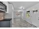 Open kitchen with gray cabinets and view into adjacent dining area at 2142 Cloverdale Se Dr, Atlanta, GA 30316