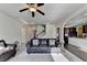 Open living space with a view of the kitchen and staircase at 622 Madison Park Dr, Grayson, GA 30017