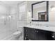 Modern bathroom with a walk-in shower and marble vanity at 1214 Bernadette Ne Ln, Atlanta, GA 30329