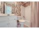 Clean bathroom with shower/tub combo and updated vanity at 2023 Ector Nw Ct, Kennesaw, GA 30152