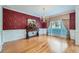 Formal dining room with hardwood floors, a chandelier, and decorative wallpaper at 2023 Ector Nw Ct, Kennesaw, GA 30152